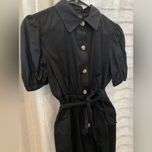 Black Who What Wear romper w/tortoise buttons, ruffle short sleeves, pockets